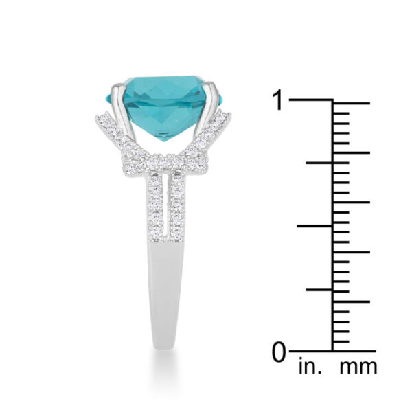Aqua cubic zirconia ring shown on a plain background at a three-quarter angle