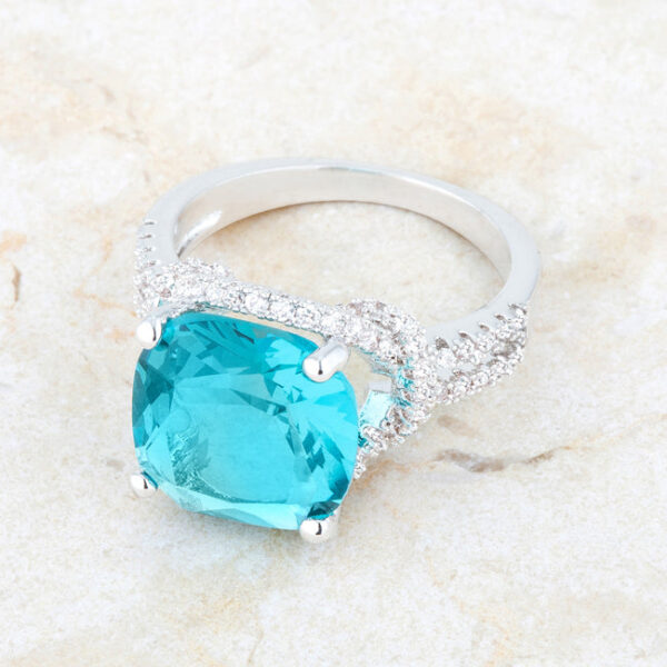 Aqua cubic zirconia ring displayed upright to show the band profile and setting height