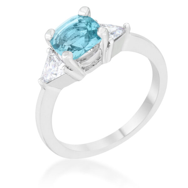 Cushion cut clear stone ring with a rhodium plated band, shown from above on a plain background
