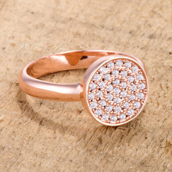 Rose gold plated circle ring on a plain background, showing the band width and stone placement