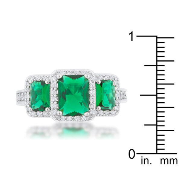 Close-up of the ring's stones showing their round cut and emerald-colored tone