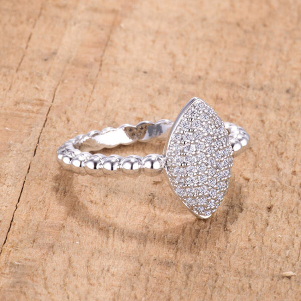 Side angle of the rhodium plated ring showing the band and the height of the oval cubic zirconia setting