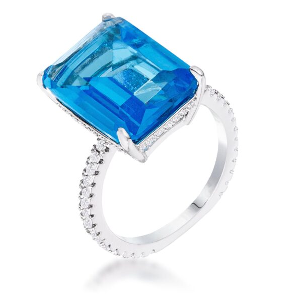 Cocktail ring with light blue cubic zirconia center stone and pave-set band