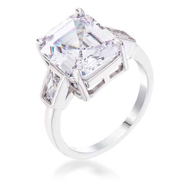 Ring with a CZ center stone flanked by two smaller stones on a silvertone band