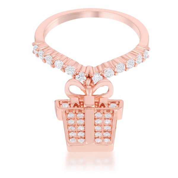 Rose goldtone ring with a bow and gift box charm set with small pave cubic zirconia stones