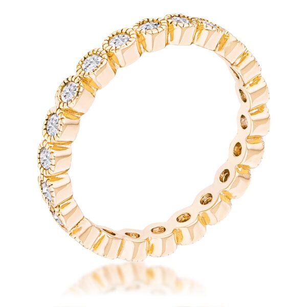 Gold plated ring with a row of clear round CZ stones set in dotted bezels around the band