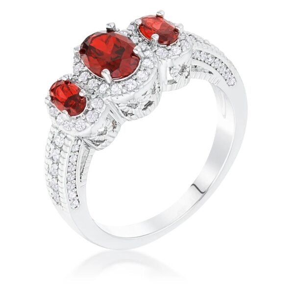 Ring with three oval red cubic zirconia stones set in a halo design on a rhodium plated band