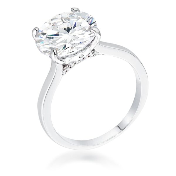 Ring with a round center stone and smaller round stones set in a silvertone band
