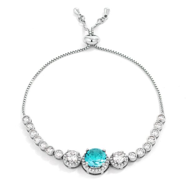 Silvertone bolo-style bracelet with graduated round aqua cubic zirconia stones laid out flat