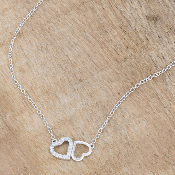 Full necklace laid out showing the chain and the joined hearts pendant