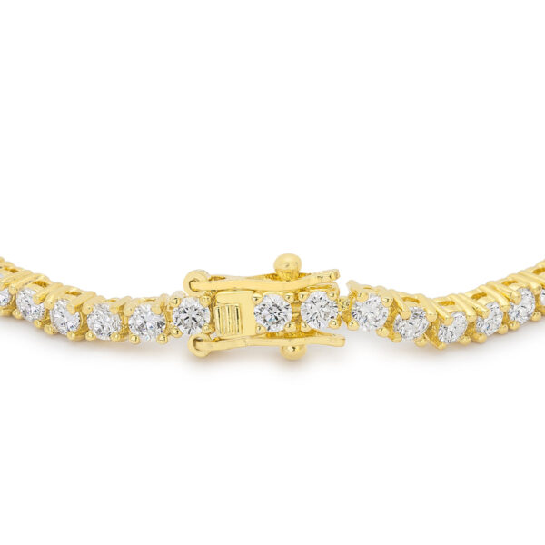 Goldtone tennis bracelet shown with its lock clasp visible