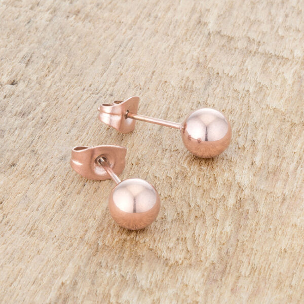 Pair of rose gold plated sphere stud earrings placed side by side
