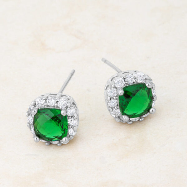 Pair of rhodium plated cushion stud earrings displayed together