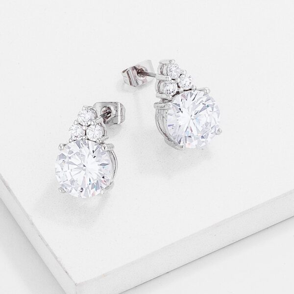 Close-up of a single rhodium plated CZ stud earring showing stone placement and metal finish