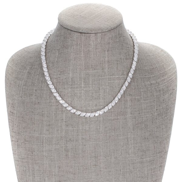 Close-up of the cubic zirconia stones showing their trillion cut and prong setting