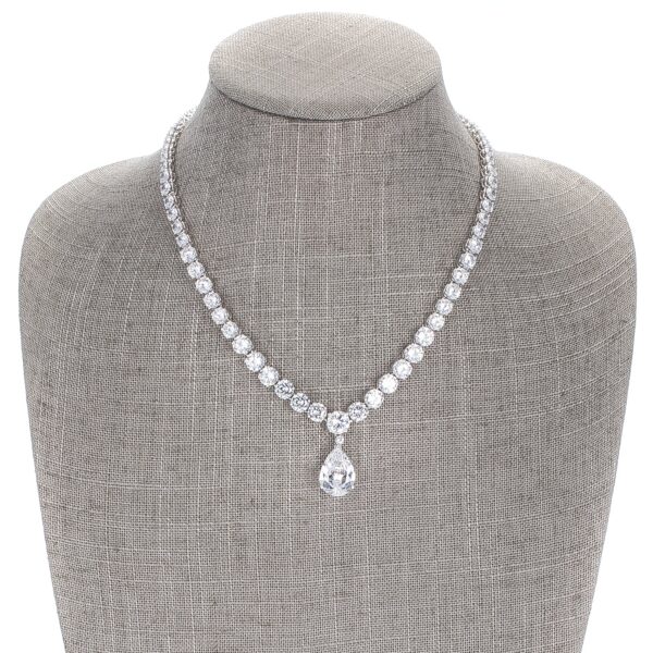 Close-up of the pear drop pendant showing pave-set round cubic zirconia detail