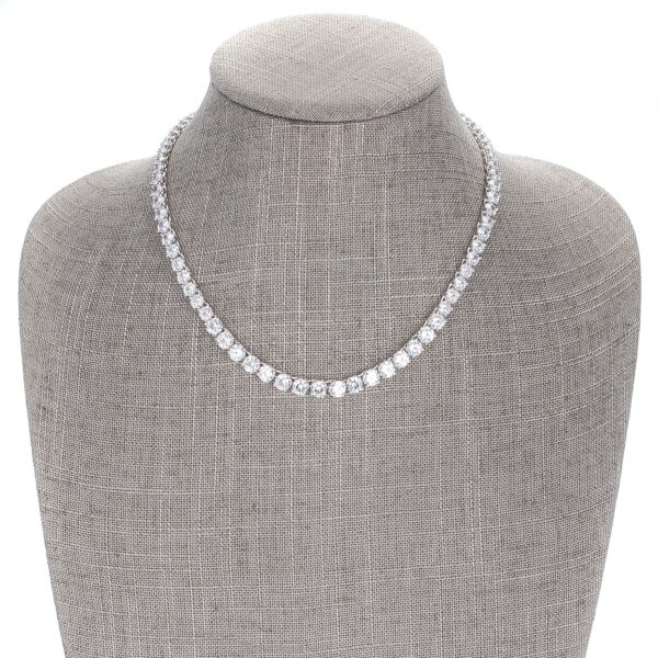 Close-up of prong-set round cubic zirconia stones showing the rhodium plated metal finish