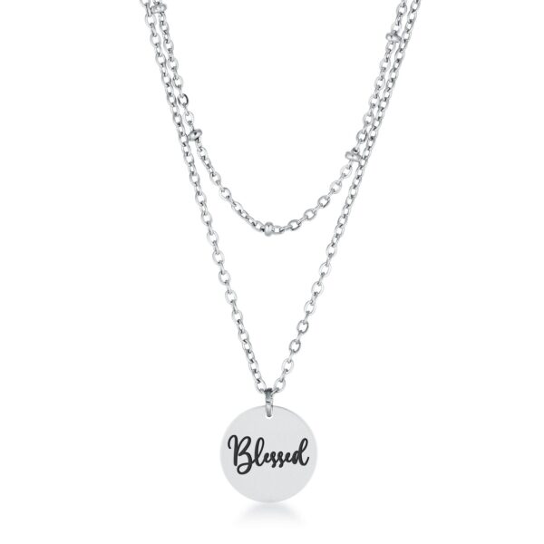 Layered chain necklace with a round engraved disc pendant reading Blessed