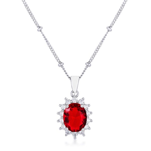 Petite oval pendant with a red stone and rhodium plated silvertone frame