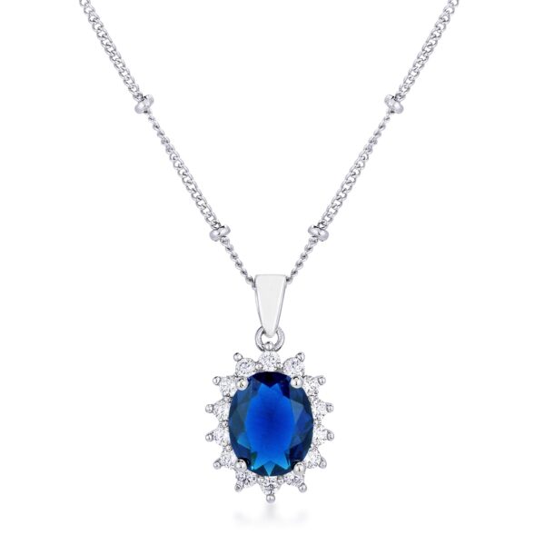 Rhodium plated oval pendant with a blue stone set at its center