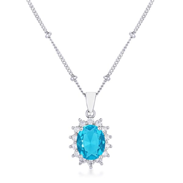 Petite oval pendant with a blue stone and rhodium-plated silvertone finish