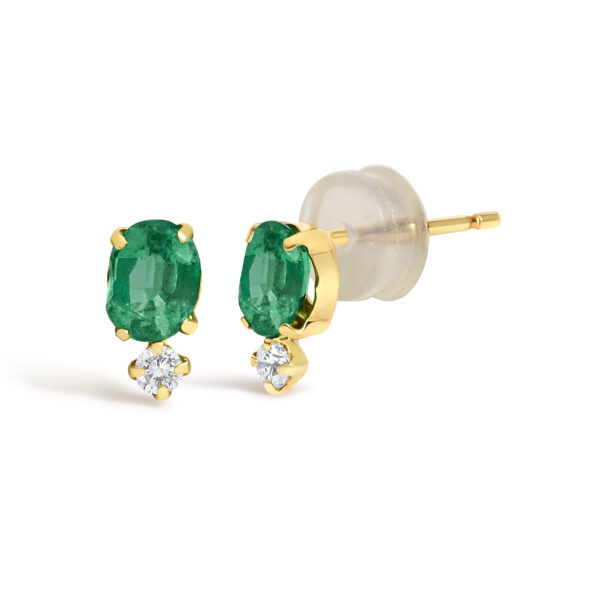Side angle of the gold stud earrings showing the prong settings and stone placement