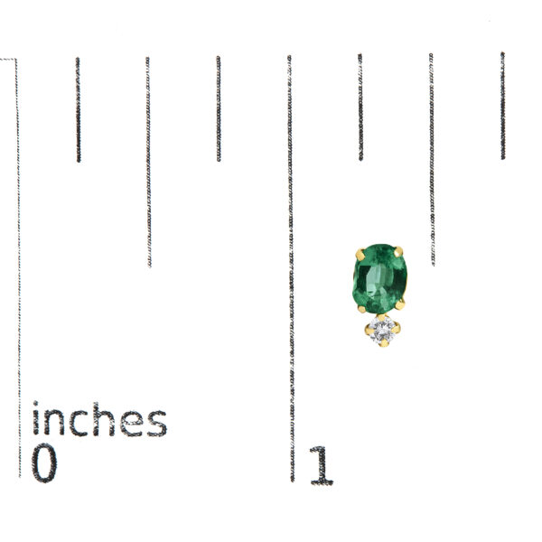 Earrings shown next to a scale reference to indicate their size