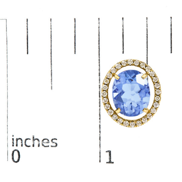 Blue fluorite and diamond stud earrings shown next to a scale reference for size