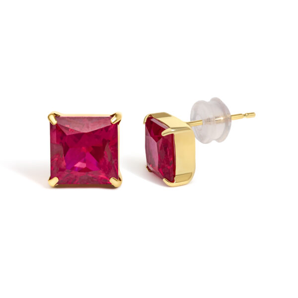 Ruby stud earrings viewed at an angle showing the gold prong setting and stone depth