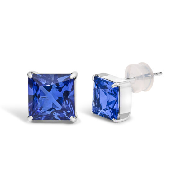 Close view of one princess-cut blue sapphire stud earring in a platinum prong setting