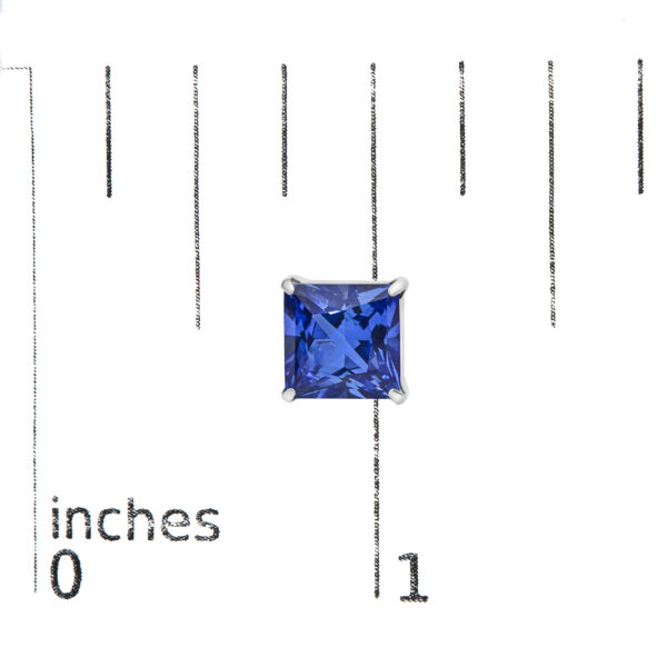 Princess-cut blue sapphire stud earrings shown next to a scale reference for size