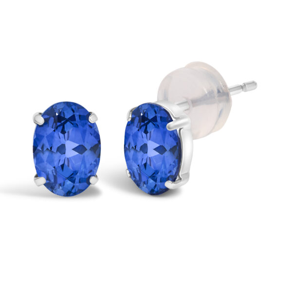 Side angle of a platinum sapphire stud earring showing the prong setting and post