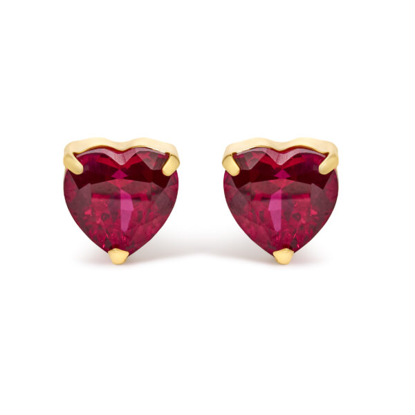 Pair of 18K yellow gold stud earrings, each set with a heart-cut red ruby in a 3-prong mount