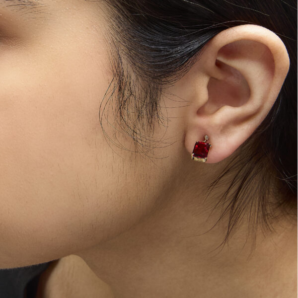 Earrings photographed as worn, showing how the dangle sits