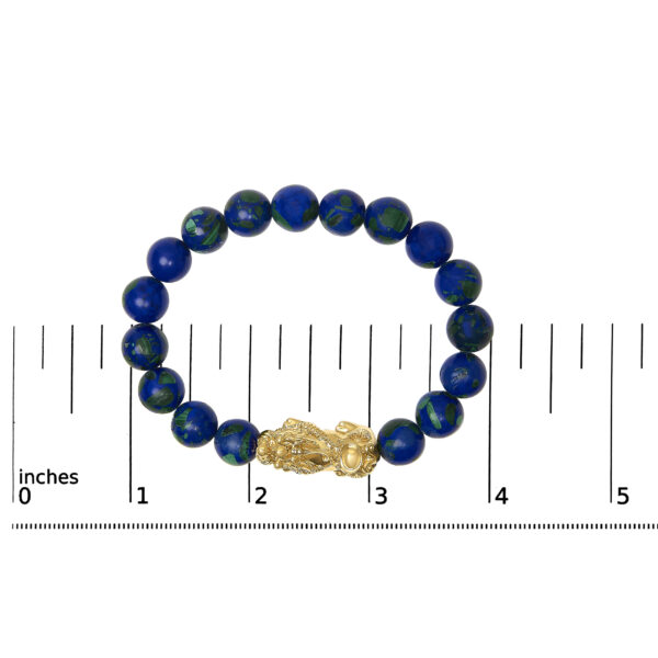 Bracelet laid flat next to a ruler showing its 7.25 inch length
