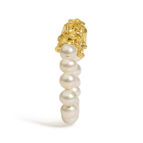 Close-up of the drilled freshwater pearls set along the gold ring band