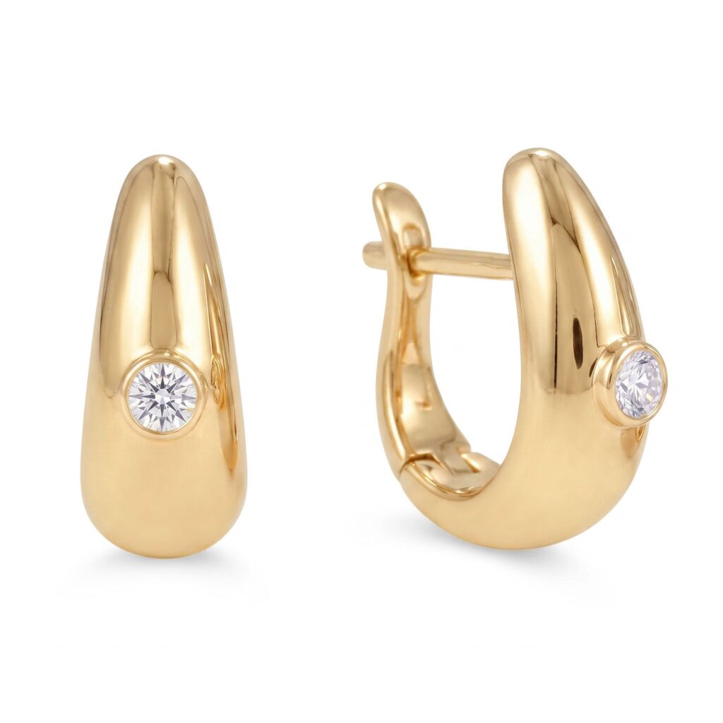 Dome-shaped 14K gold plated hoop earring with a single round bezel-set stone at center