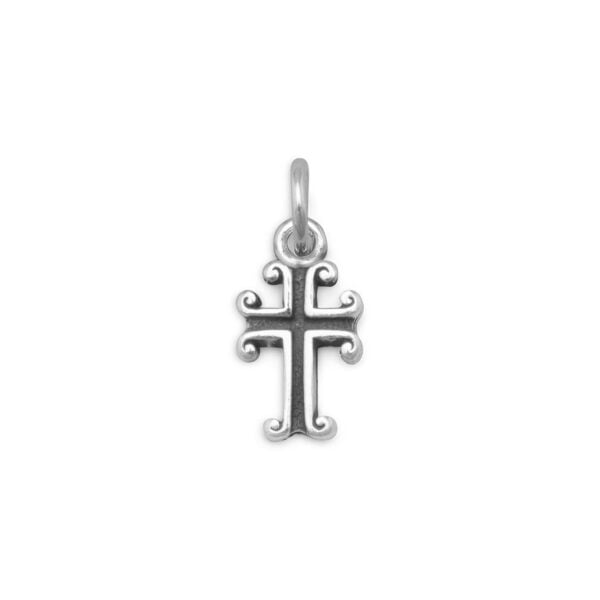 Small ornate cross charm with scrolled edges and a jump ring