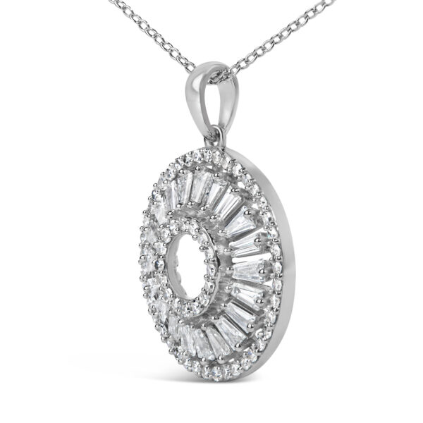 Close-up of the diamond openwork medallion pendant highlighting the prong-set round and baguette diamonds