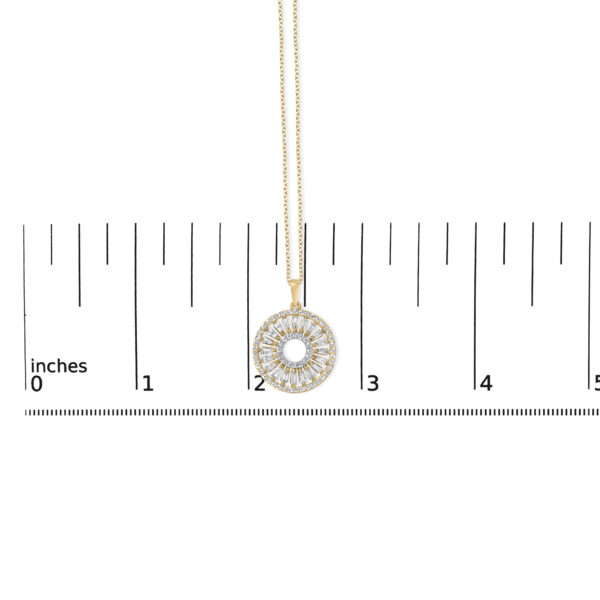 Sunburst medallion pendant shown next to a scale reference for size