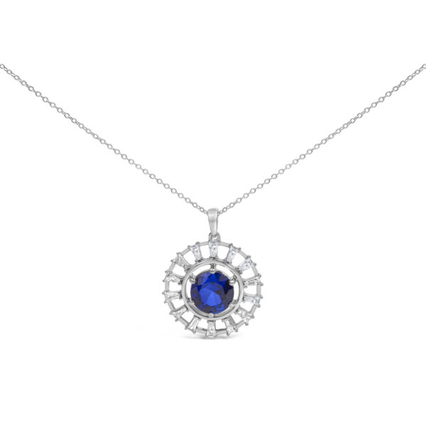 Sapphire and baguette diamond medallion pendant on a cable chain, shown flat against a plain background