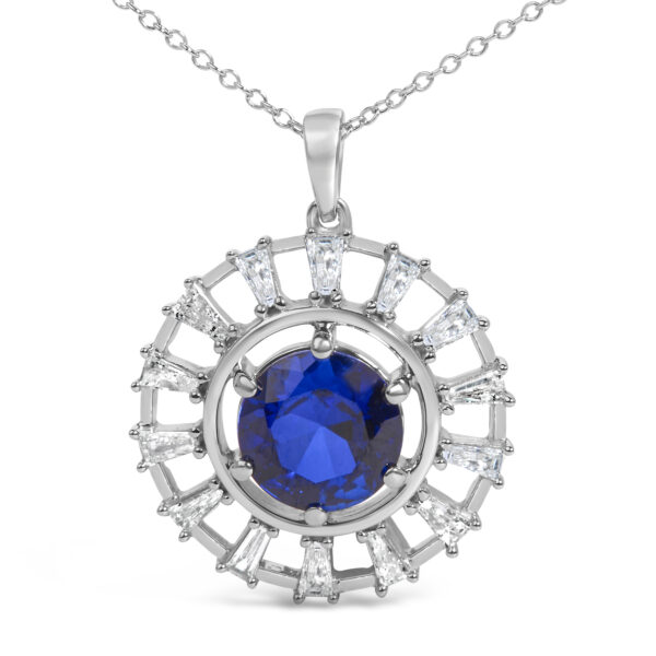 Close view of the round sapphire center stone and surrounding baguette diamonds in prong settings