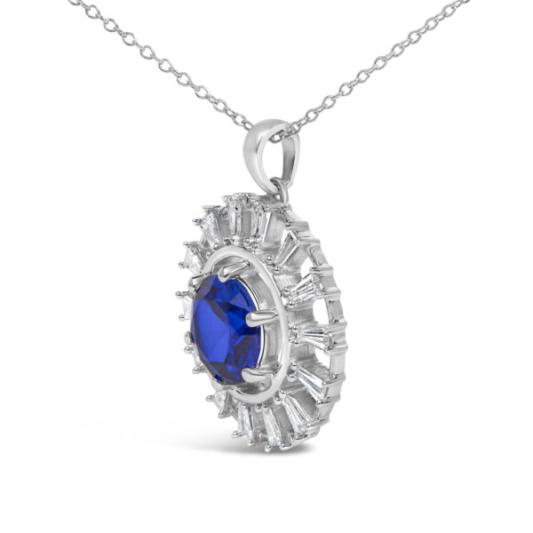 Side angle of the medallion pendant showing the setting depth and edge of the sterling silver mounting
