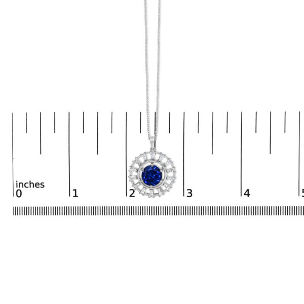 Medallion pendant shown next to a scale reference to indicate its size
