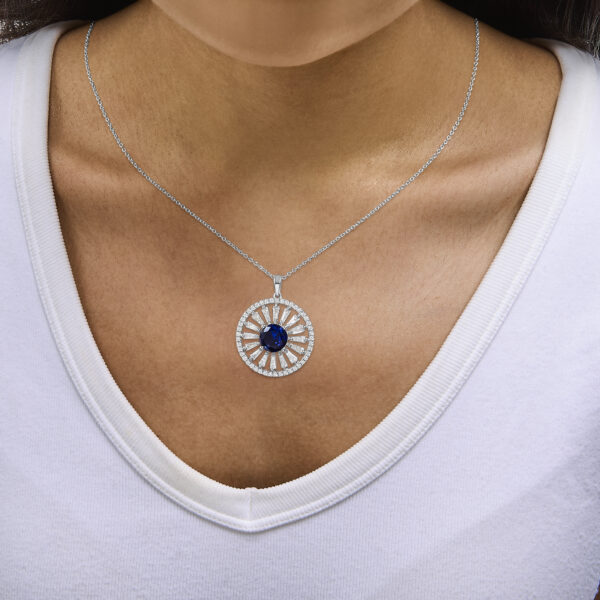 Pendant necklace worn on a neck, showing the medallion resting below the collarbone on the chain