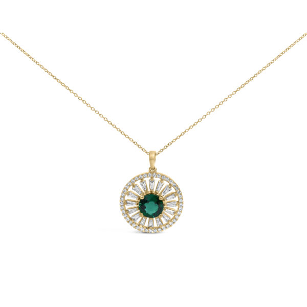 Sunburst medallion pendant with a center green stone and diamond-set rays on a cable chain