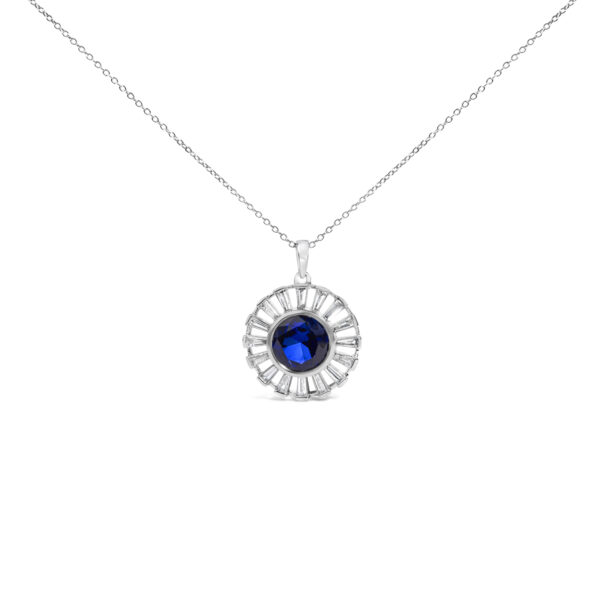 Round medallion pendant with a blue center stone framed by baguette diamonds, on a cable chain