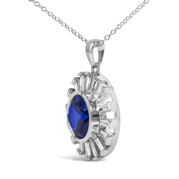 Side angle of the medallion pendant showing the depth of the bezel setting and chain attachment