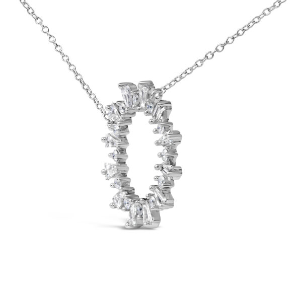 Close-up of the prong-set baguette and round diamonds within the starburst medallion