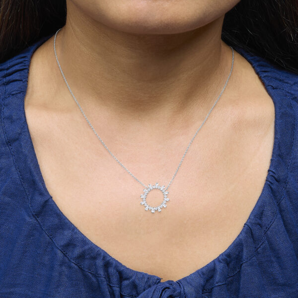 Diamond starburst medallion pendant worn on an 18 inch cable chain
